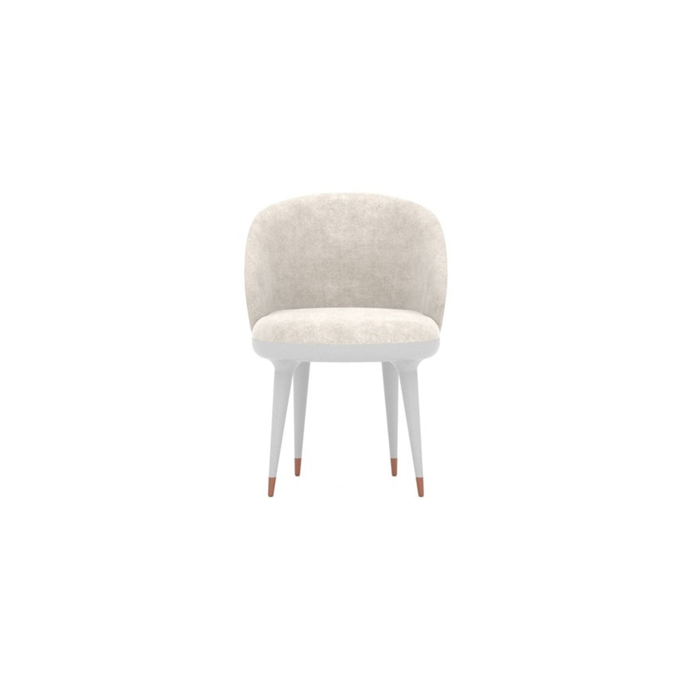 Loda Furniture Tulip dining chair with sleek modern design, upholstered seat and curved legs, in a contemporary style.