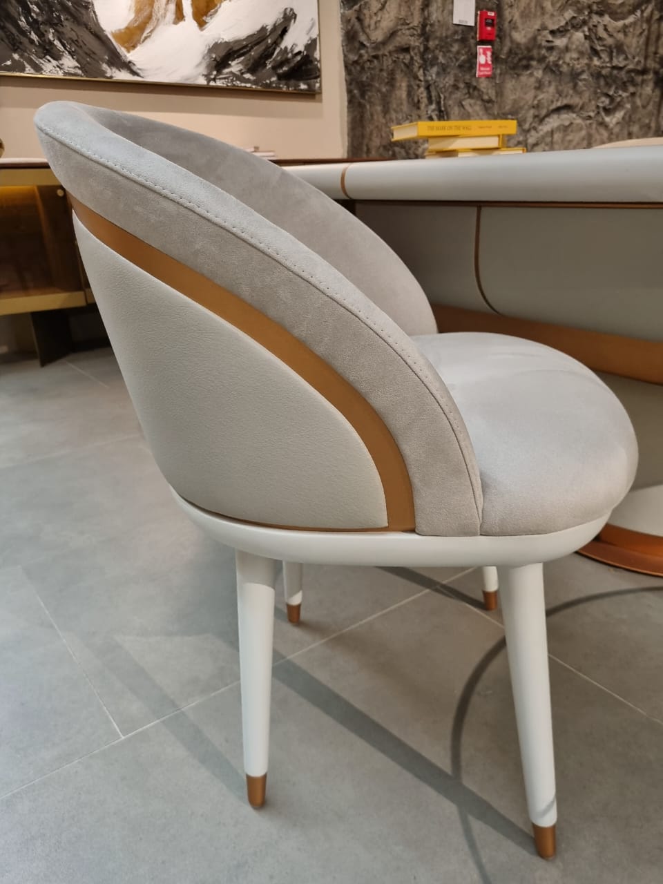 Display of a Tulip dining chair by LODA Furniture with a sleek modern design and smooth white finish.