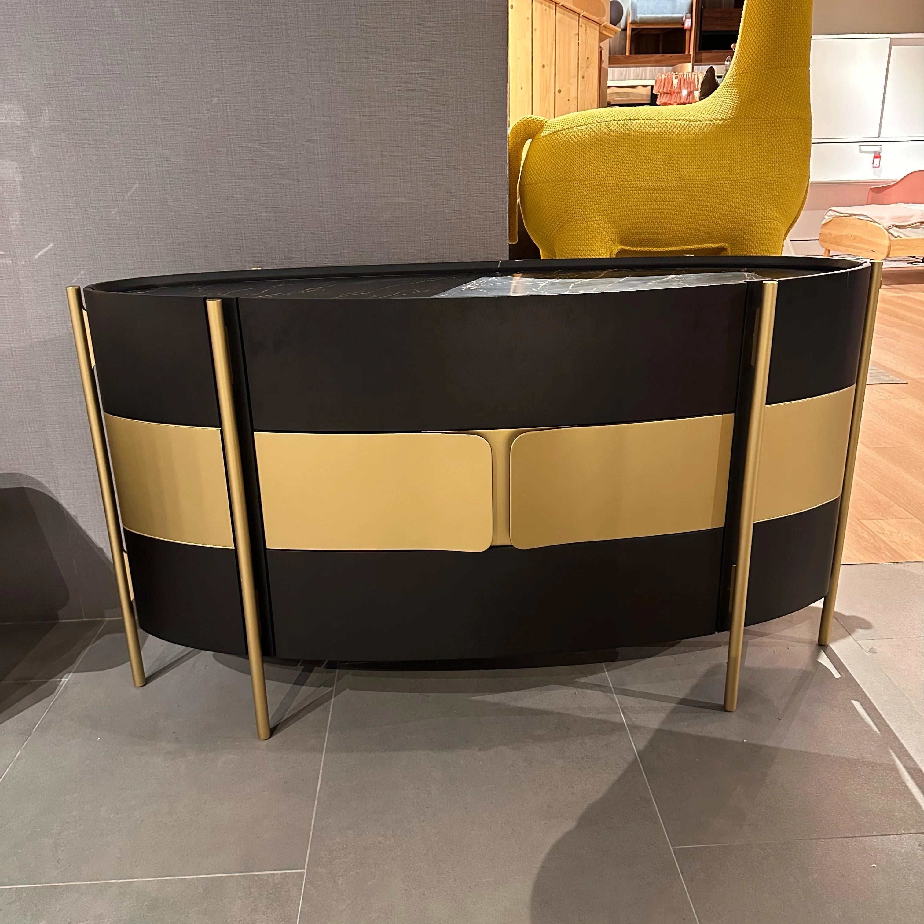 Display item of a Vega chest of drawers dresser in gold walnut finish, 158cm tall, from Loda Furniture, showcasing its sleek design.