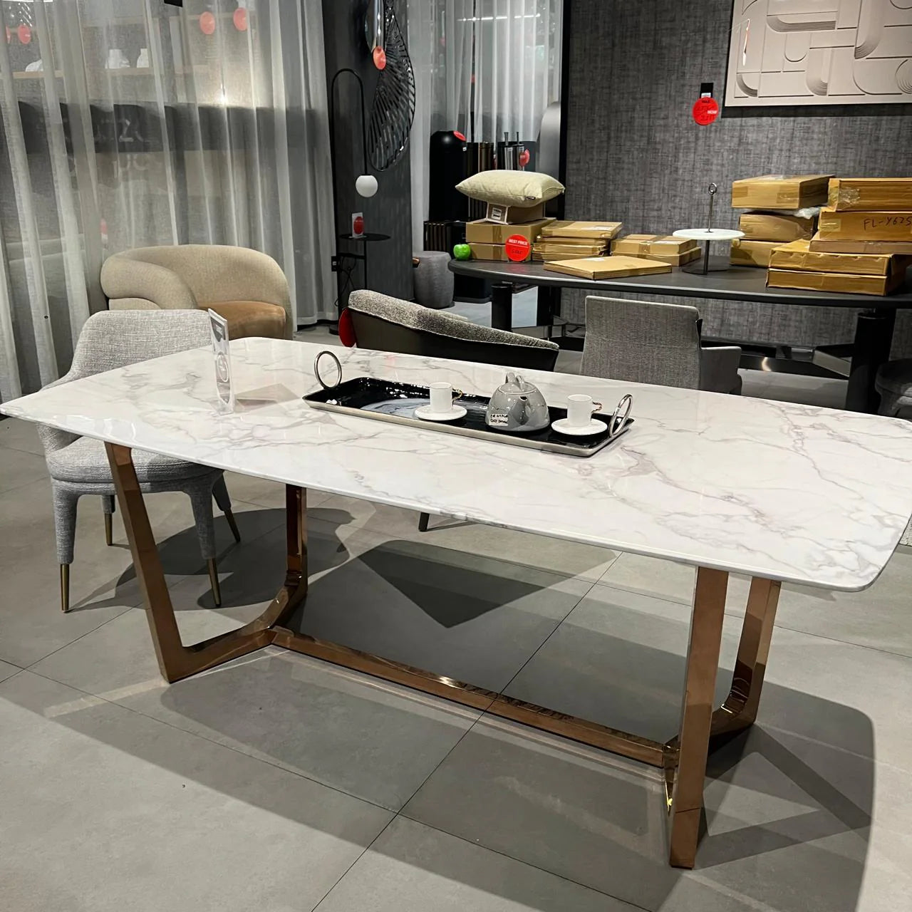 Display of Venice faux marble dining table by Beacon, showcasing its elegant tabletop and modern design.