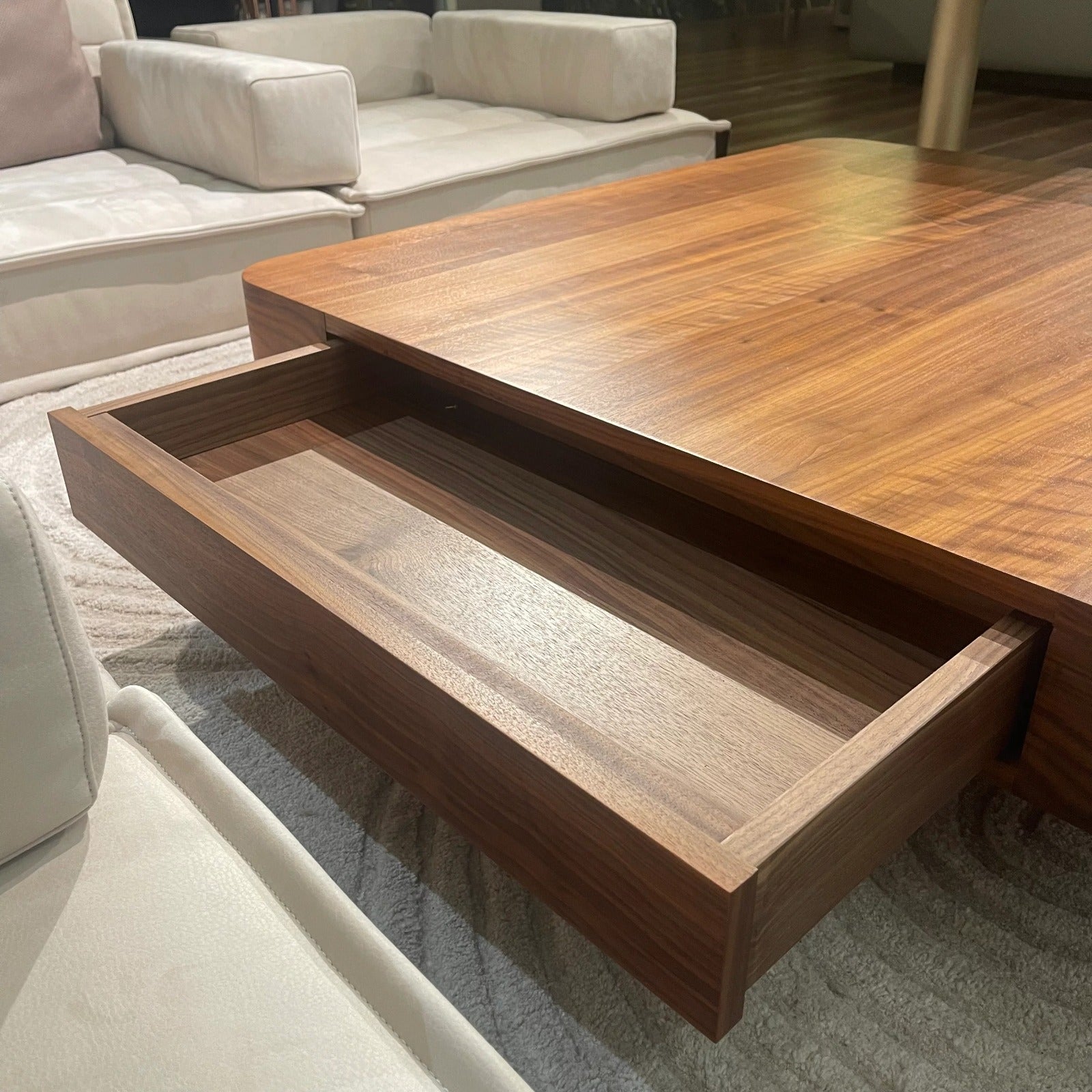 Display item showing a wagon-style center table by ORIX with a rustic wooden finish and metal accents.