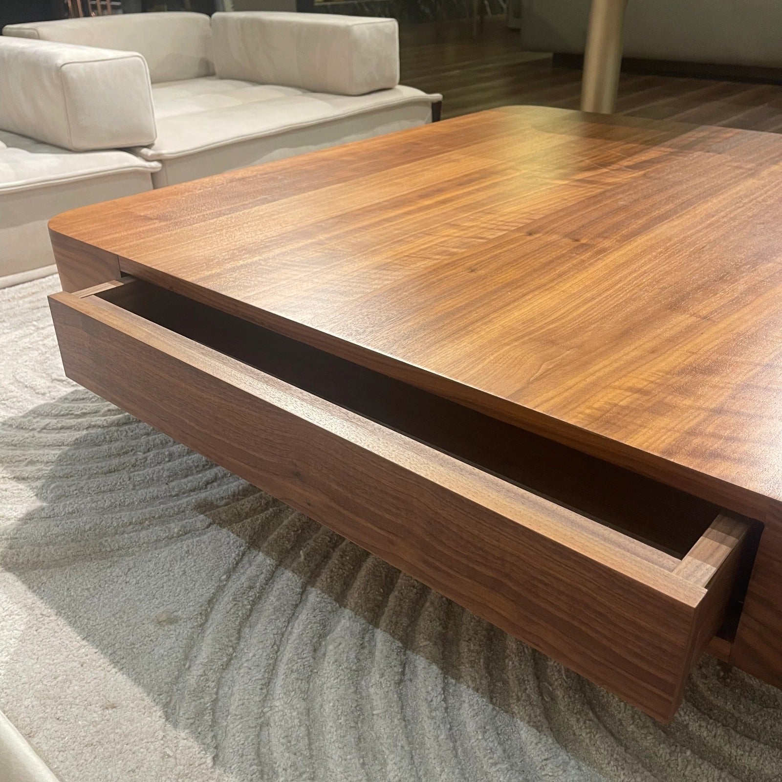 Display item showing a wagon-shaped center table by ORIX, featuring a rustic wooden finish and sturdy metal accents.