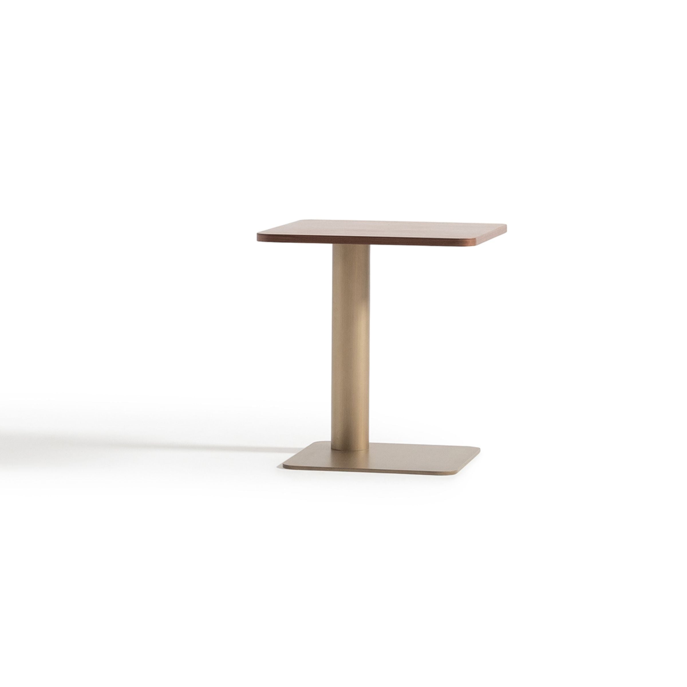 Modern wagon-style side table by ORIX with a sturdy wooden surface and metal legs, ideal for living room or bedroom decor.