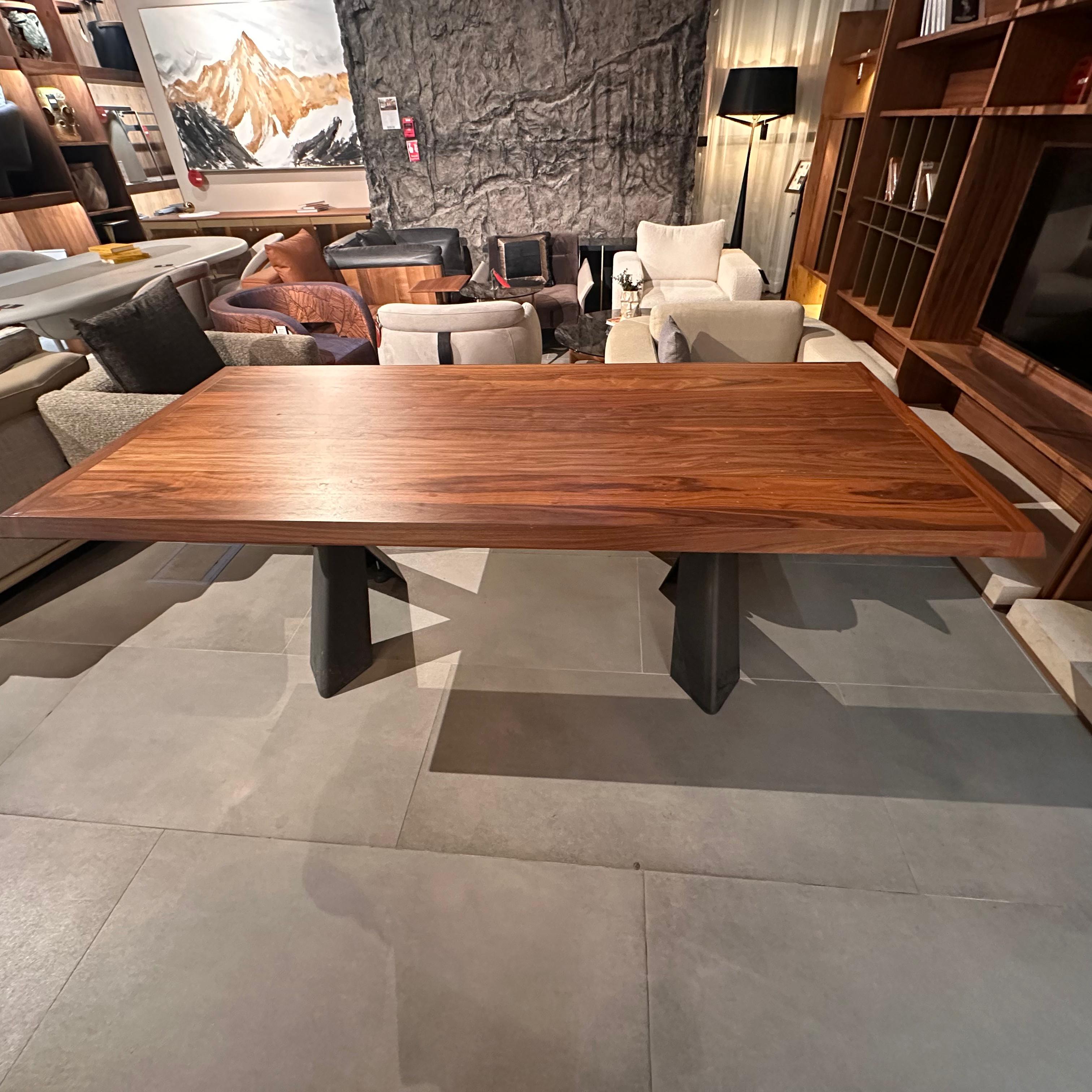 Display piece of the Genova dining table by YOL LIVING, showcasing the wooden tabletop and sturdy legs.