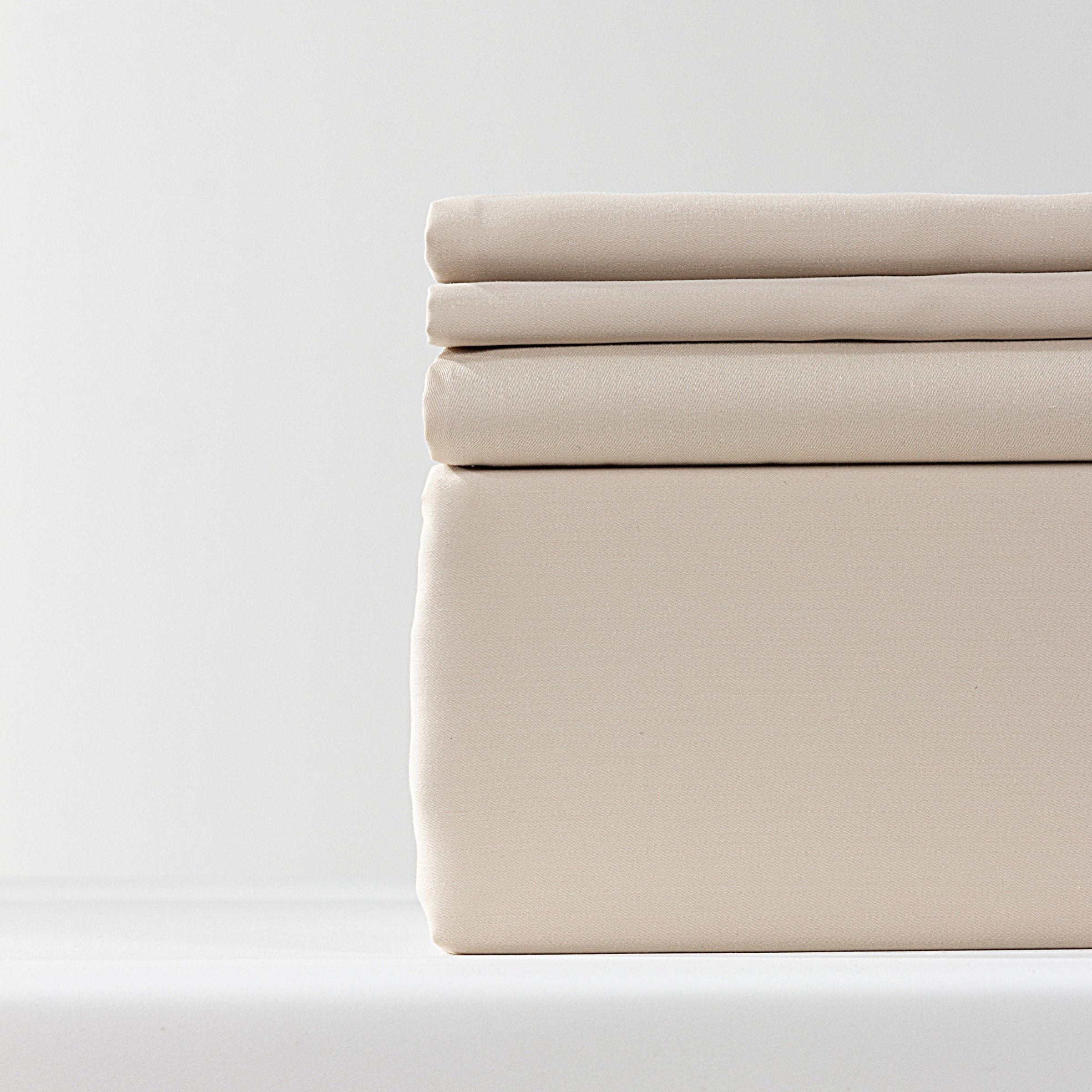 Beige bedding set by Beacon with 245x260cm duvet cover, 220x240cm sheet, and 60x88cm pillowcases in soft fabric.