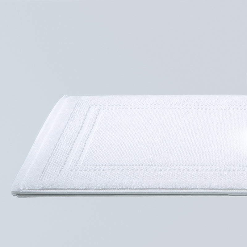 Ebarza Jacquard Bath Mat by BEACON, beige and white textured fabric, plush and absorbent for bathroom comfort.