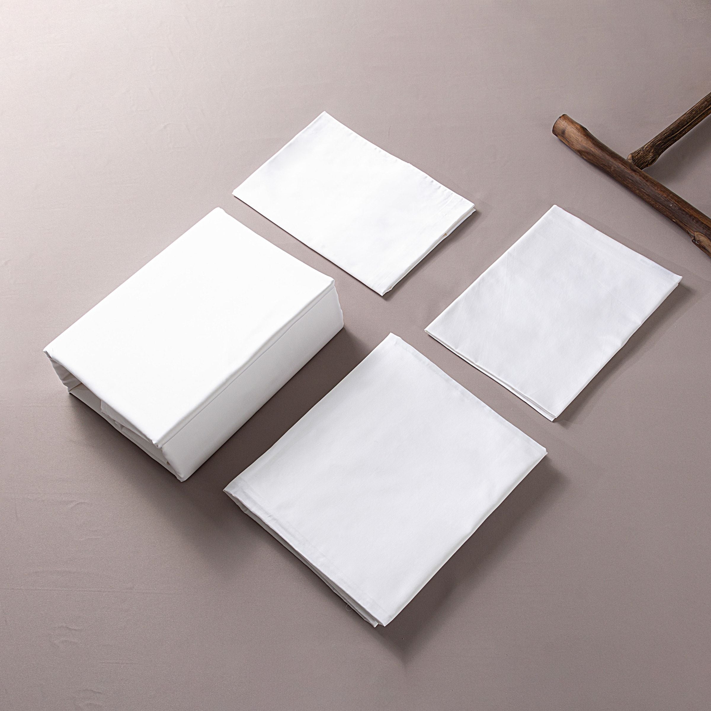 White bedding set by BEACON with a 245x260cm duvet cover, 220x240cm sheets, and 60x88cm pillowcases.