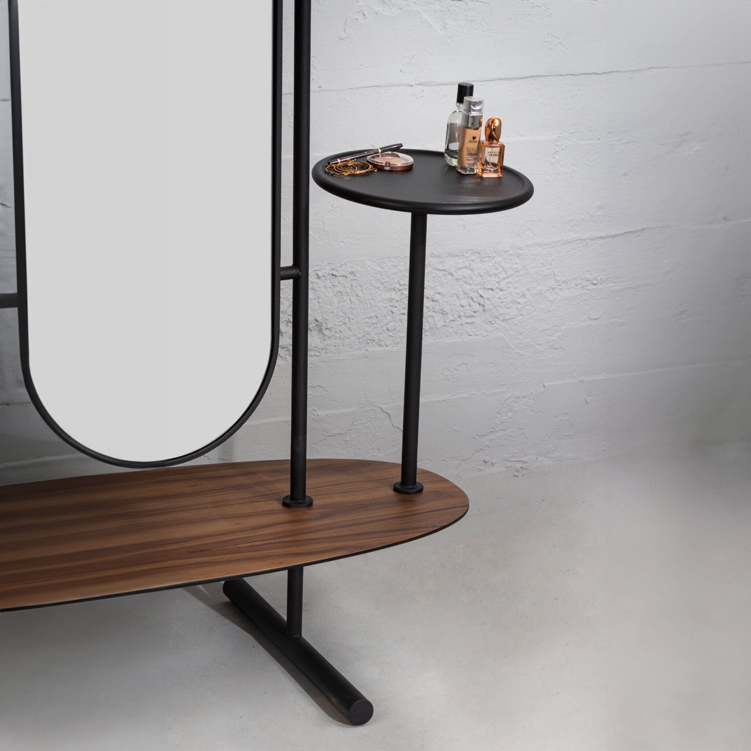 Electra Mirror EM001-TG by TOGO HOME STYLE features a sleek, modern design with a reflective glass surface and a sturdy frame.