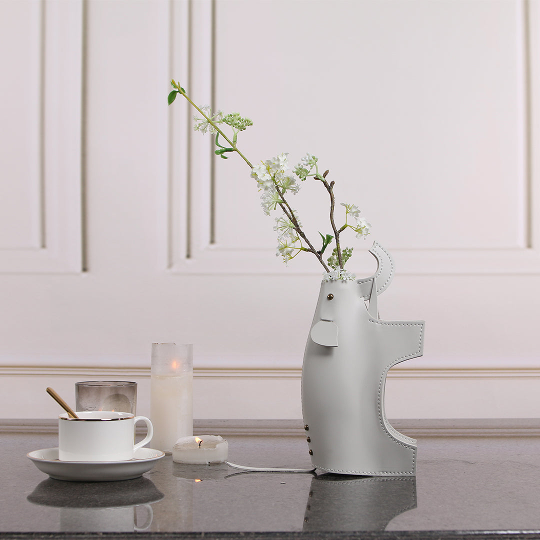 Beige elephant-shaped ceramic vase sculpture by BEACON, featuring intricate details and a smooth finish.