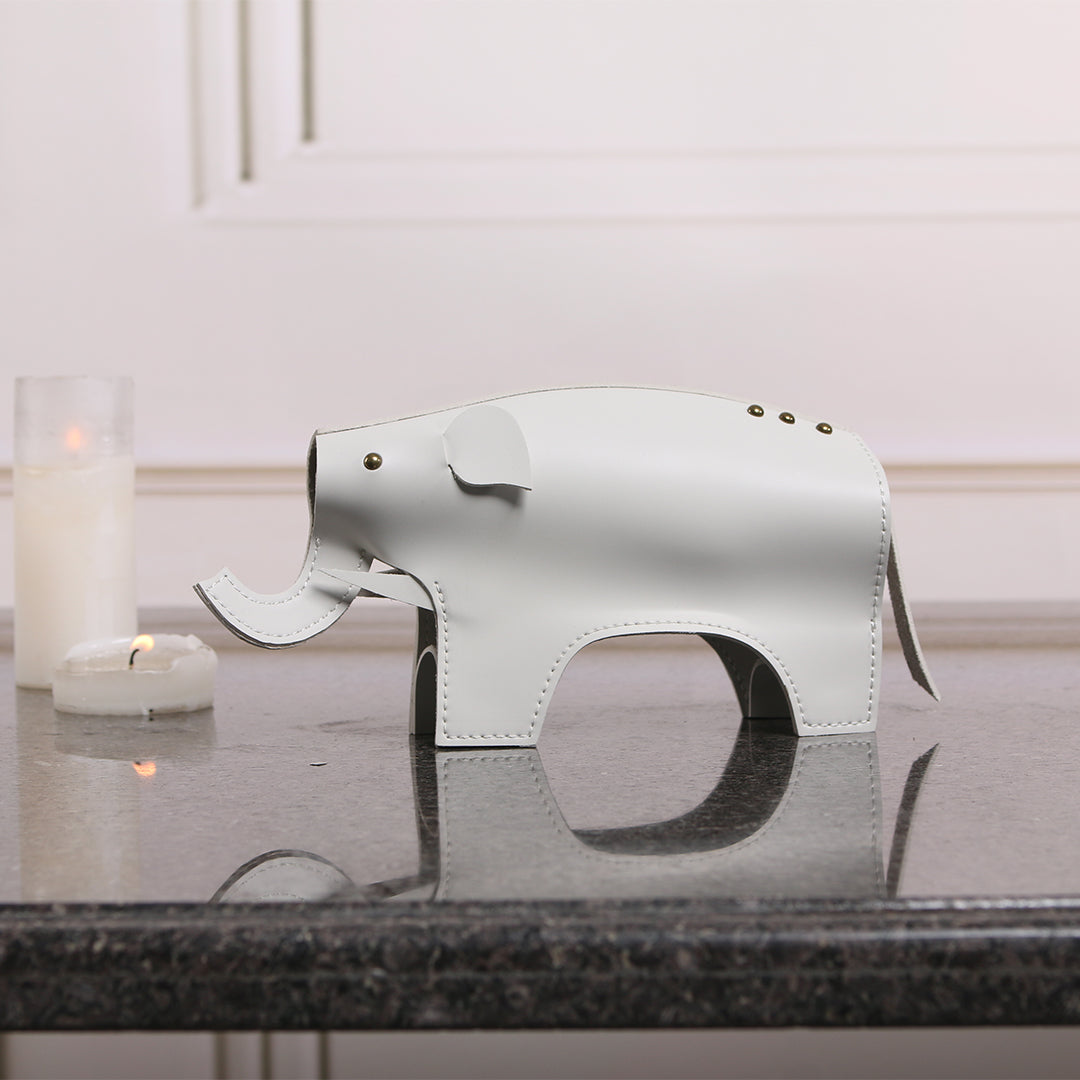 Beige elephant-shaped vase sculpture by BEACON, detailed ceramic vessel with textured surface, perfect for home decor.