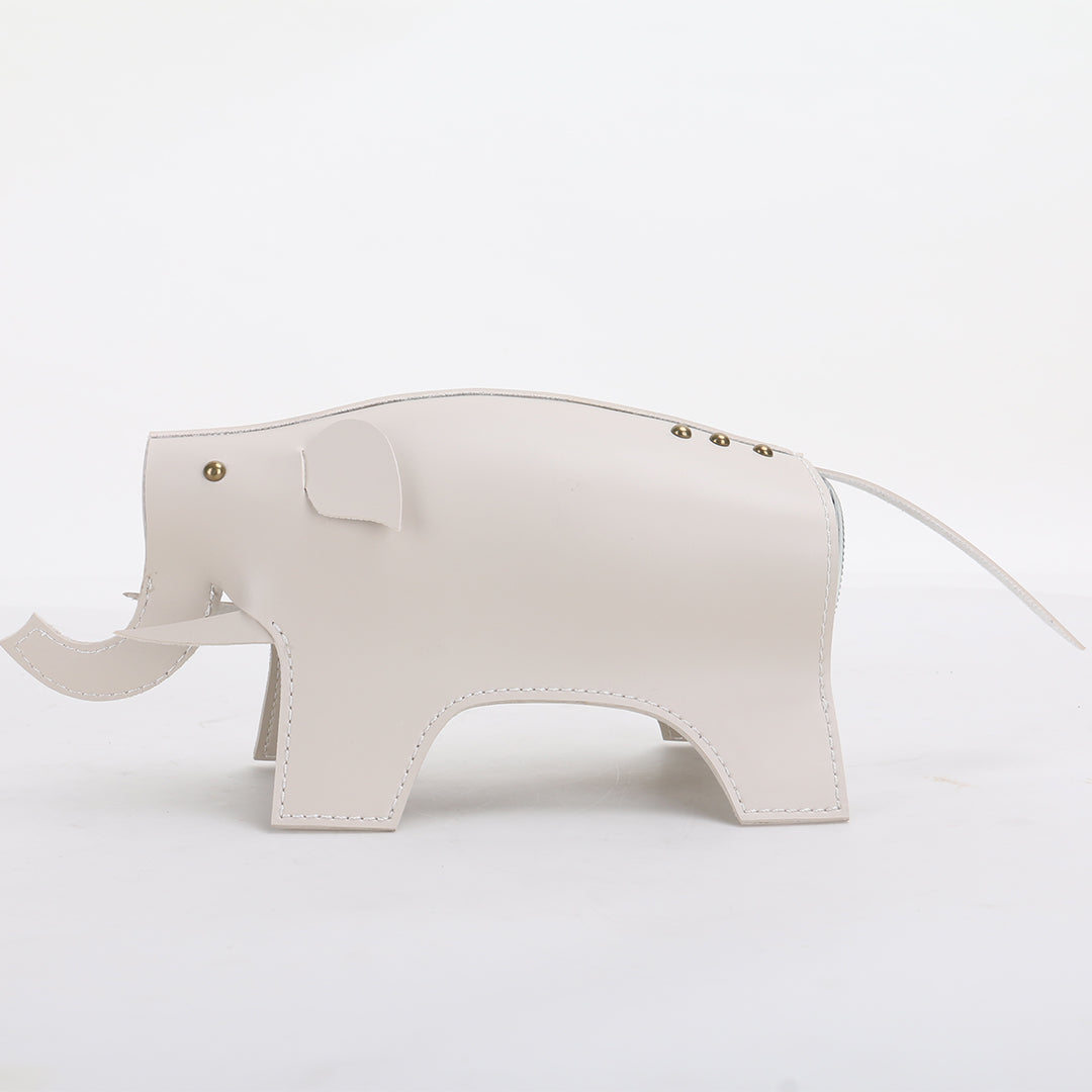 Beige elephant-shaped ceramic vase sculpture from BEACON, detailed with realistic features, designed as a decorative vase.