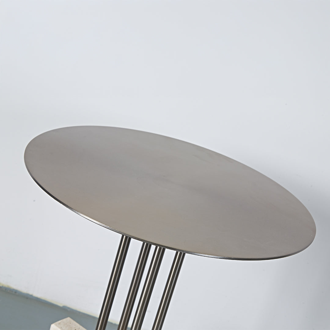Elysian Travertine Side Table by BEACON, featuring a sleek design with a travertine surface and modern metal legs.