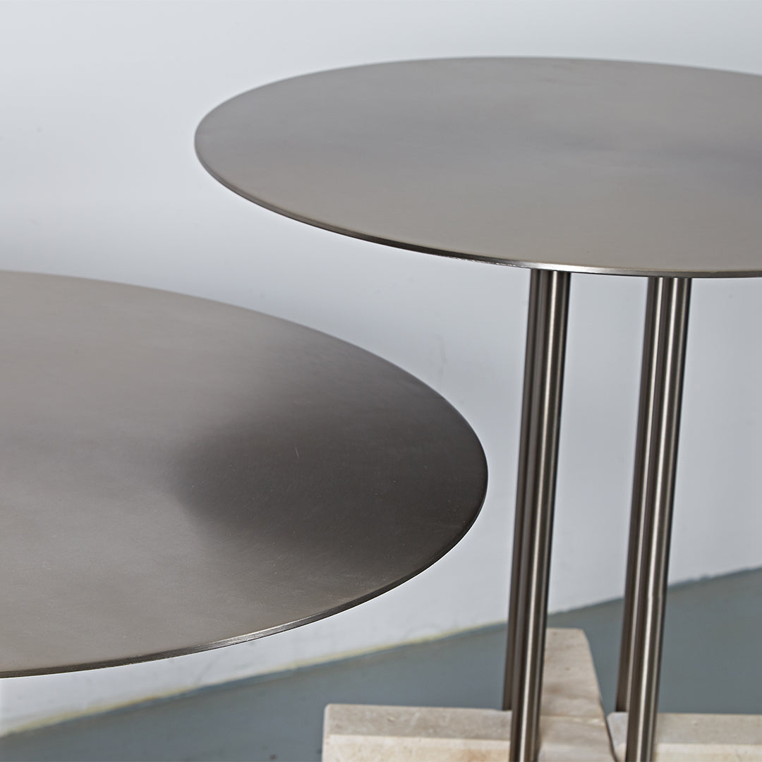 Elysian Travertine Side Table by BEACON featuring a sleek design and natural stone surface, ideal for modern living spaces.