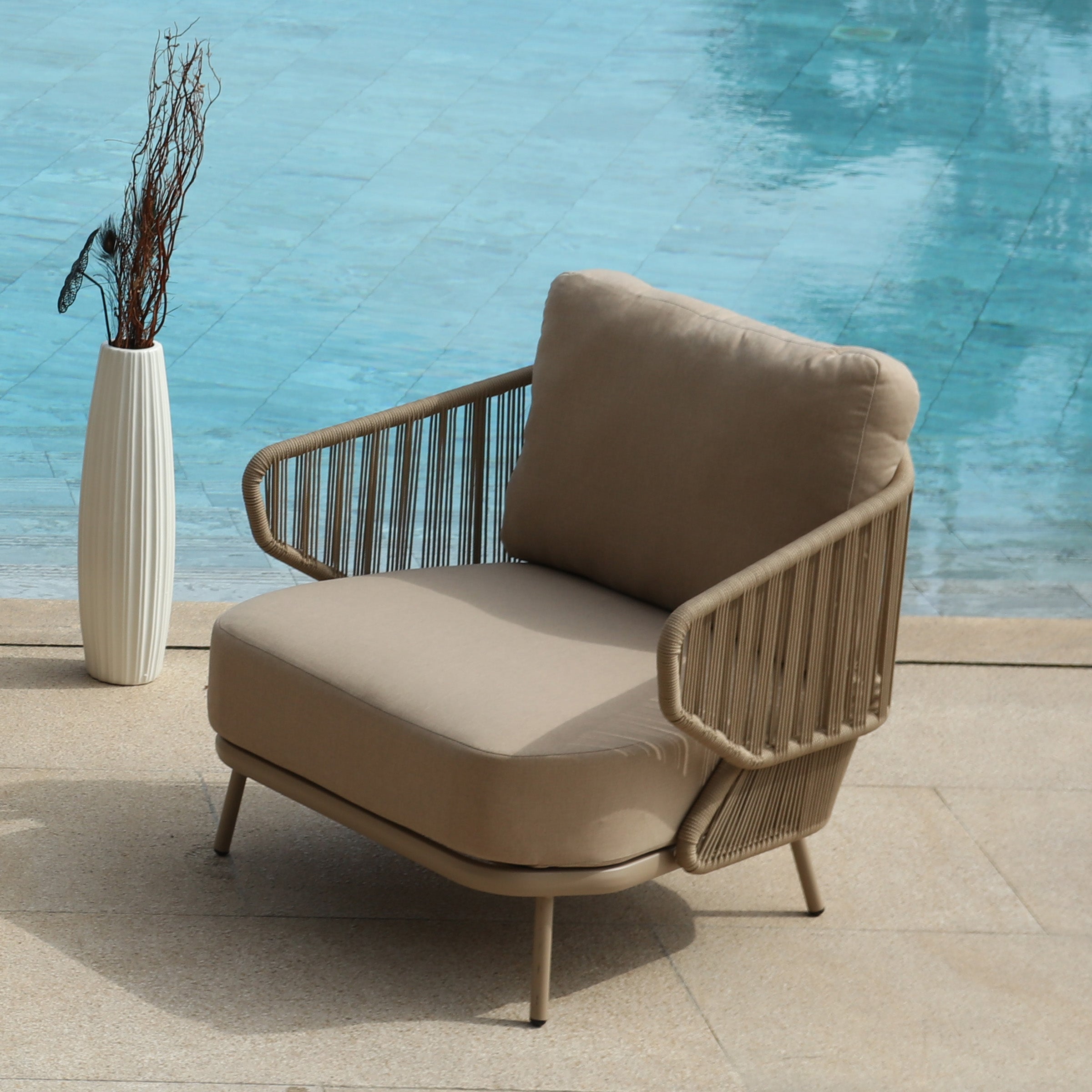 Embrace outdoor armchair by BEACON, stylish outdoor chair with cushioned seat and armrests for comfortable outdoor relaxation.