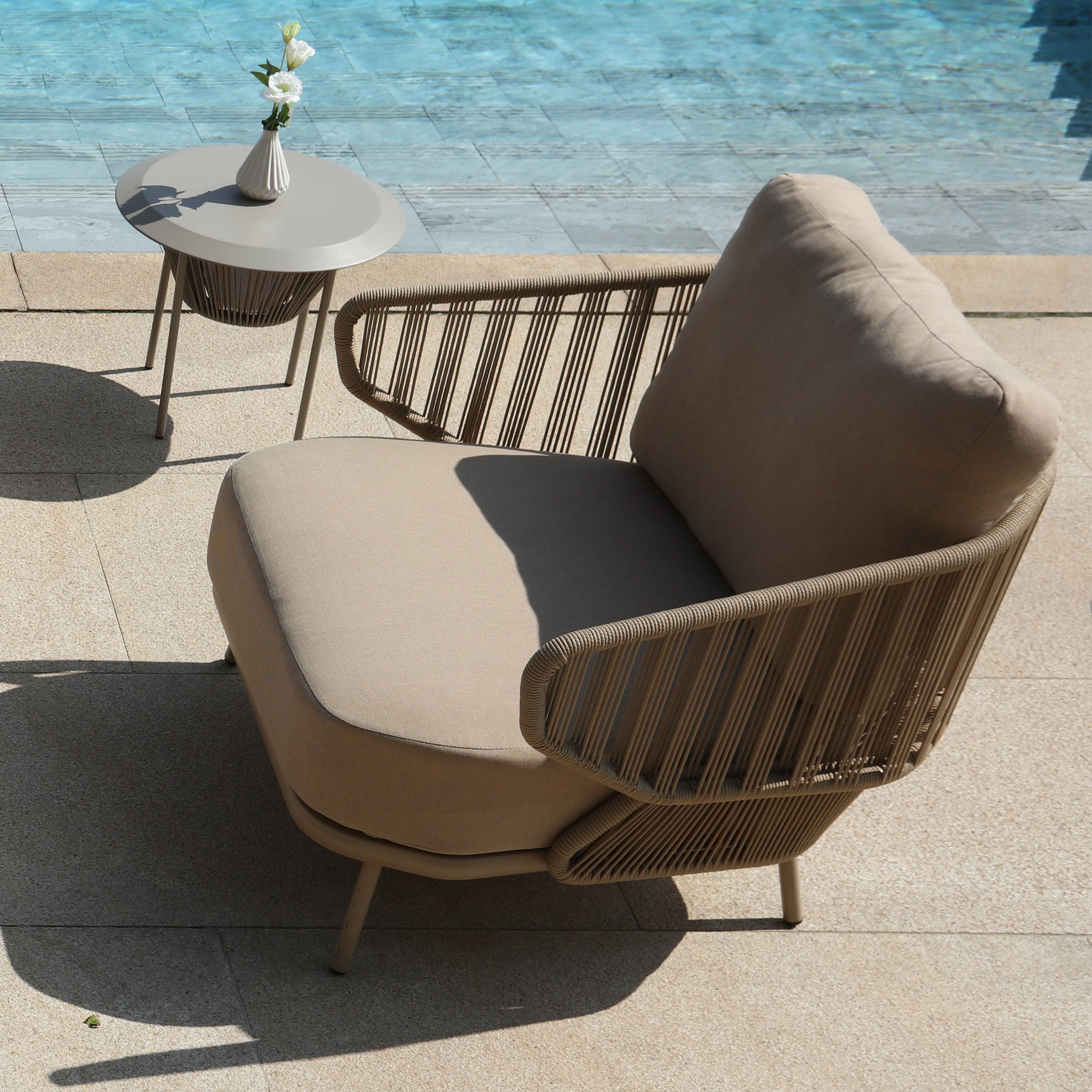 Embrace outdoor armchair from BEACON MYX-SOFA030, stylish outdoor chair with cushioned seating and armrests in a garden setting.
