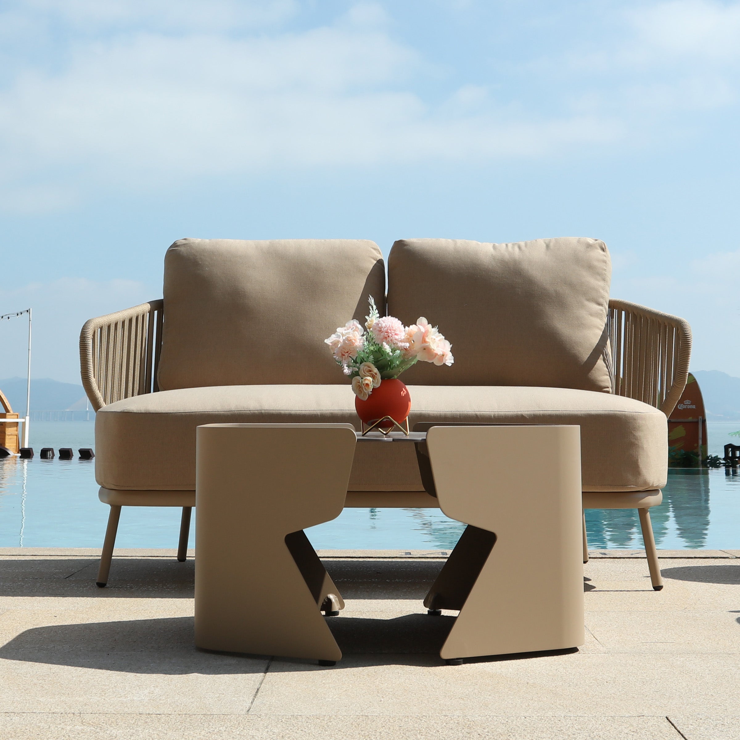Outdoor BEACON Embrace Outdoor Love 2-Seat Sofa with cushioned seating and modern design, perfect for patio or garden relaxation.