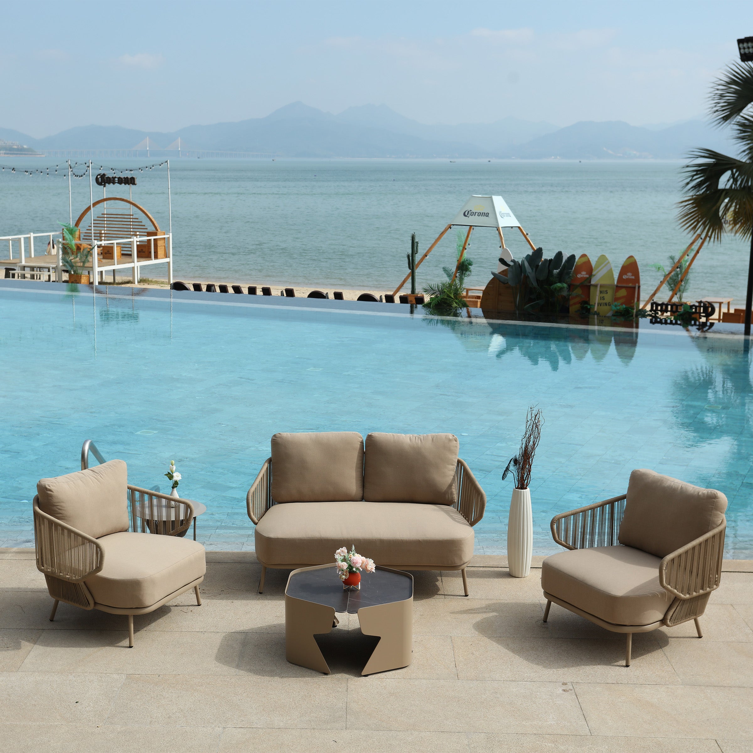 Outdoor BEACON Embrace Love 2-Seat Sofa with cushioned seating and metal frame, perfect for patio or garden relaxation.