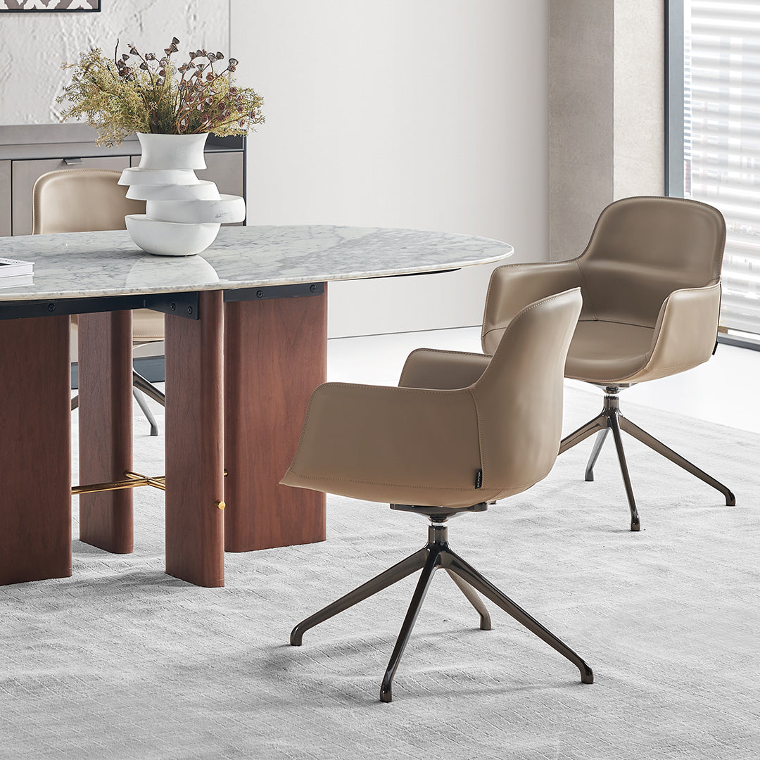 Beige saddle leather dining chair with contoured seat and wooden legs, designed by BEACON for elegant dining room décor.