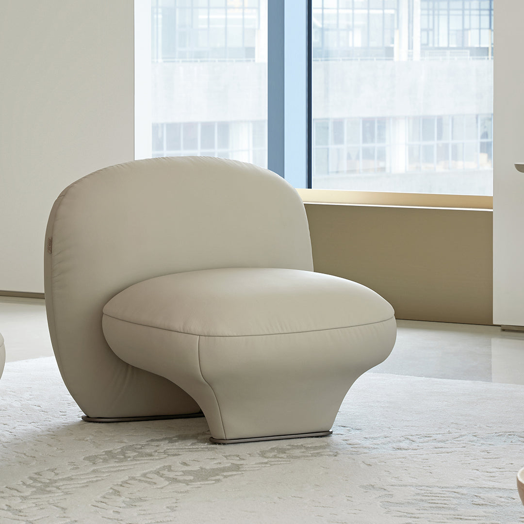 Euphoria armchair by BEACON with plush fabric and modern design, featuring a comfortable cushioned seat and stylish armrests.
