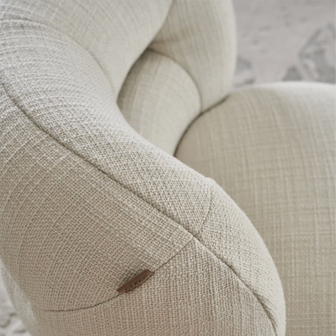 BEACON Ferrara armchair AMCJ-DY6057 with plush upholstery and modern design, shown from a front angle.