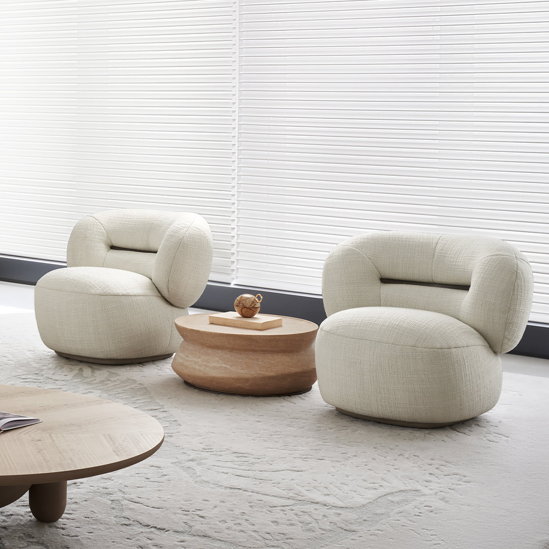 BEACON Ferrara armchair AMCJ-DY6057 with plush fabric upholstery and modern design, shown in a cozy living room setting.