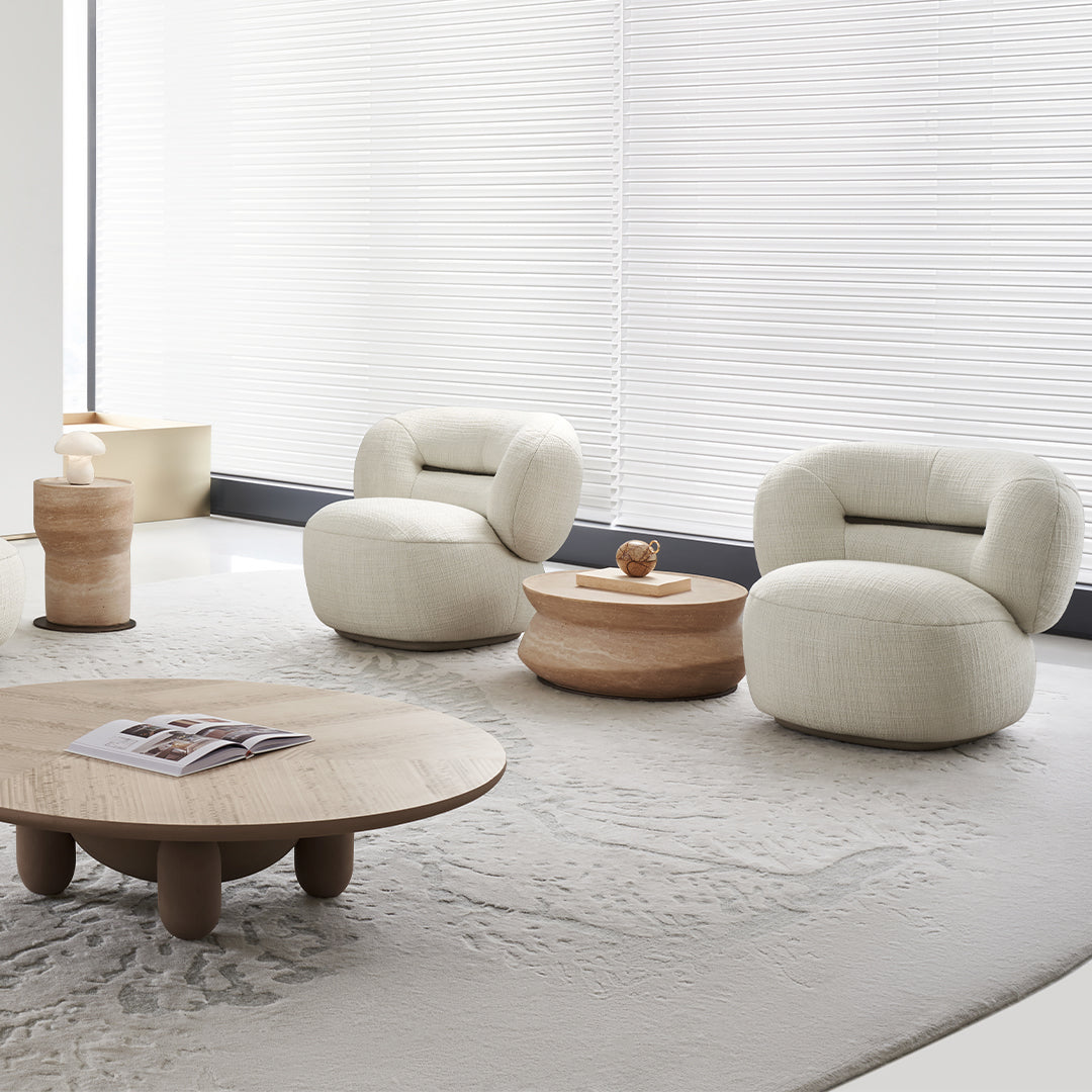 BEACON Ferrara Armchair AMCJ-DY6057 with plush fabric upholstery and modern design, shown in a cozy living room setting.