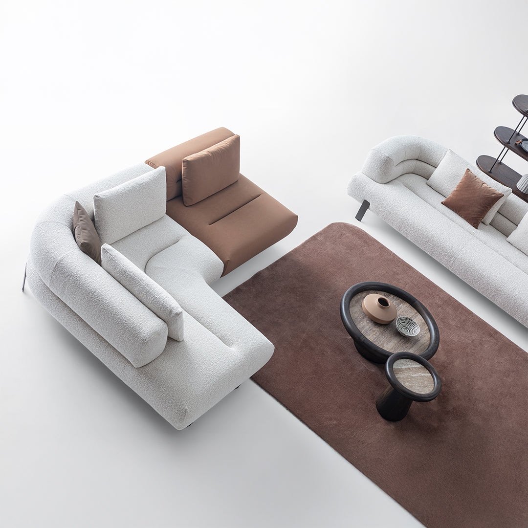 Freda corner sofa by Homage Koltuk, two-seater with left arm, in a modern display setting, showcasing its stylish design.