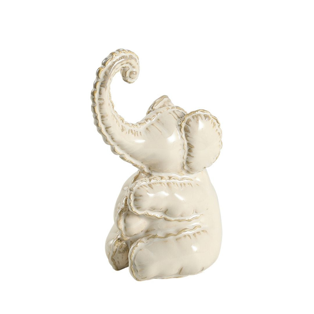 Cute ceramic elephant figurine from BEACON, perfect as a charming home decor decorative figurine.