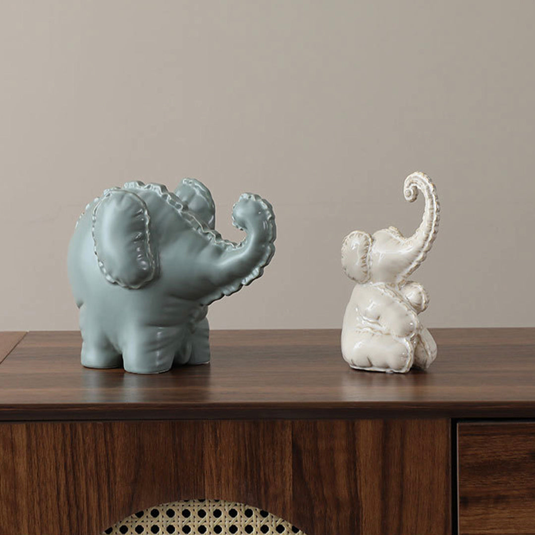 Cute ceramic elephant figurine from BEACON, perfect for home decor, featuring a whimsical design and detailed craftsmanship.