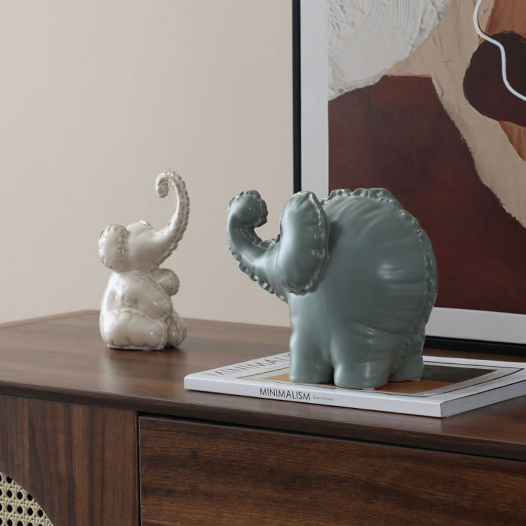 Cute ceramic elephant figurine by BEACON, perfect as a charming home decor decorative figurine.
