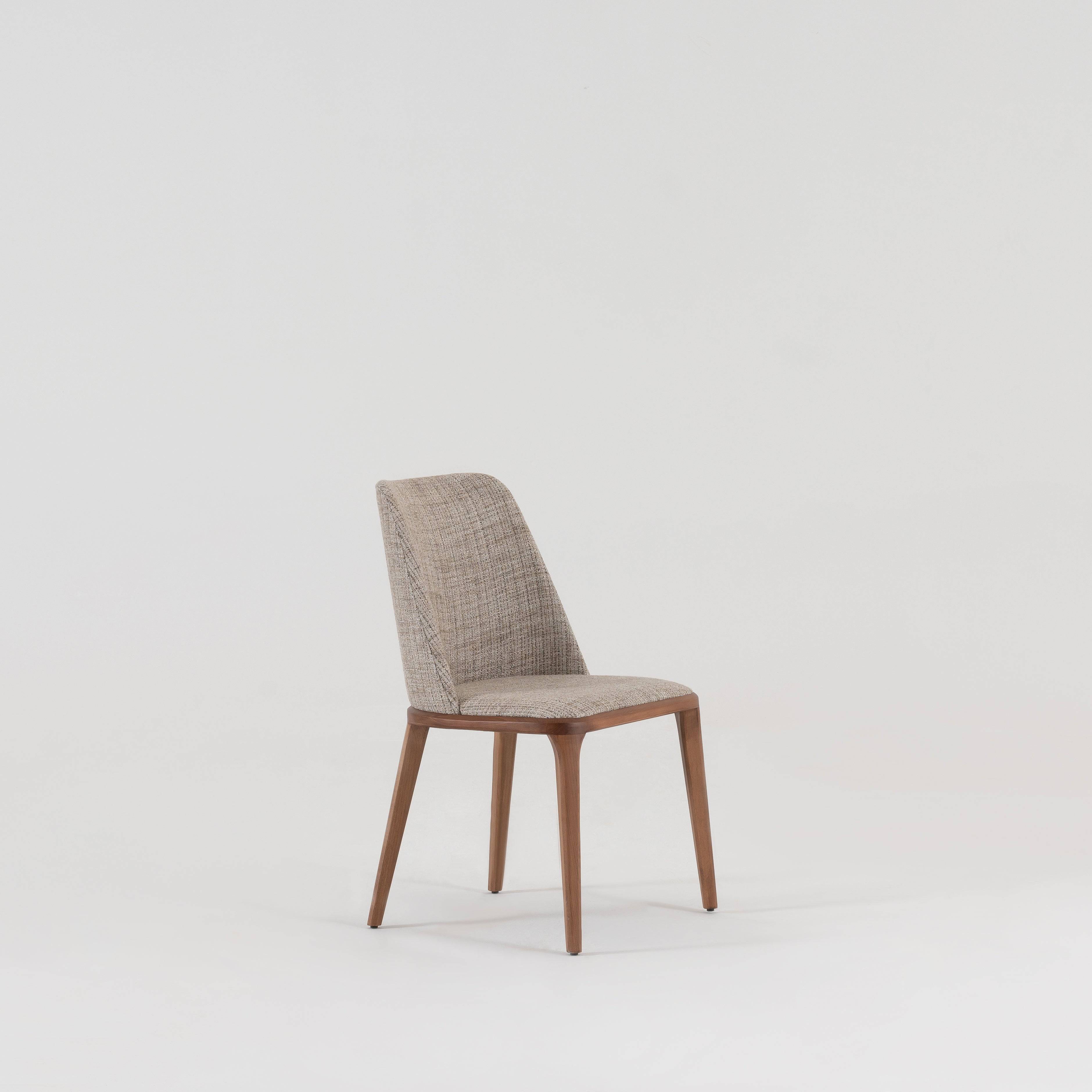Genova dining chair by YOL Living, showcasing a modern design with a wooden seat and metal legs.