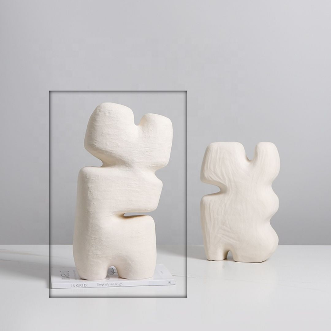 Beige geometric layered block figurine by BEACON, modern home decor accent, featuring abstract geometric design.