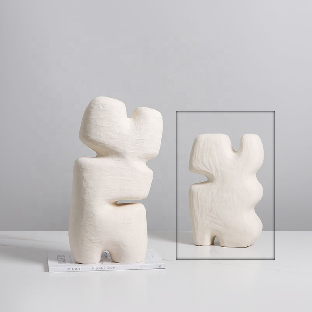 Beige geometric layered block figurine by BEACON, modern home decor sculpture with abstract geometric design.