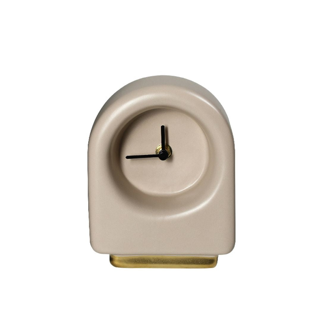 Gold ceramic table clock with a gold base from BEACON, featuring a classic round face and elegant design.