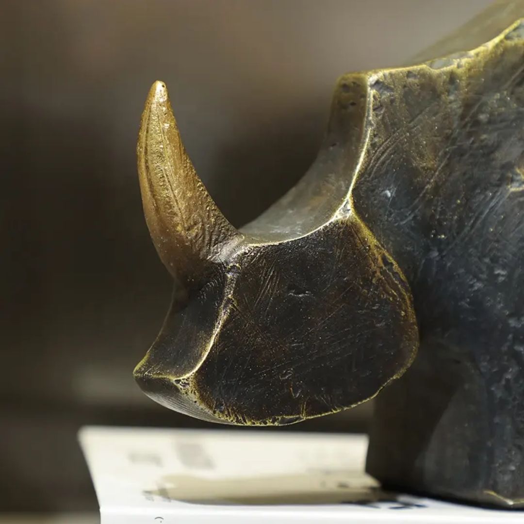 Golden Horned Rhino B home decor figurine by BEACON, detailed golden rhinoceros sculpture for stylish interior decoration.