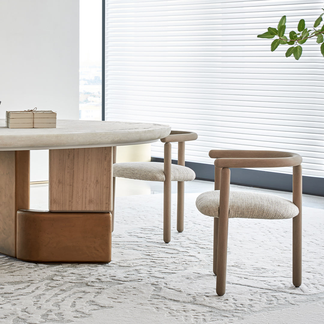 Elegant Grandeur Dining Chair by BEACON with cushioned seat and wooden legs, suitable for modern dining rooms.