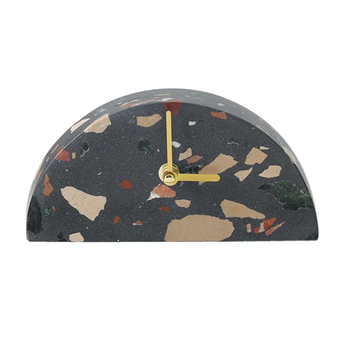 Dark-colored half-round stone table clock by BEACON, featuring a sleek design and easy-to-read clock face.