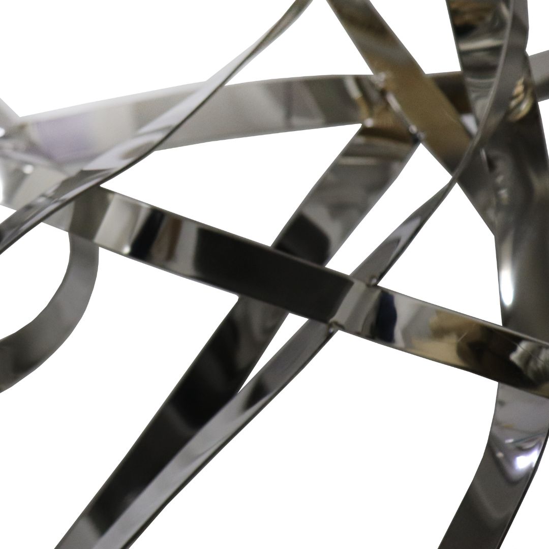 Hand-crafted stainless steel artwork by BEACON, featuring intricate designs and a polished finish, displayed against a neutral background.