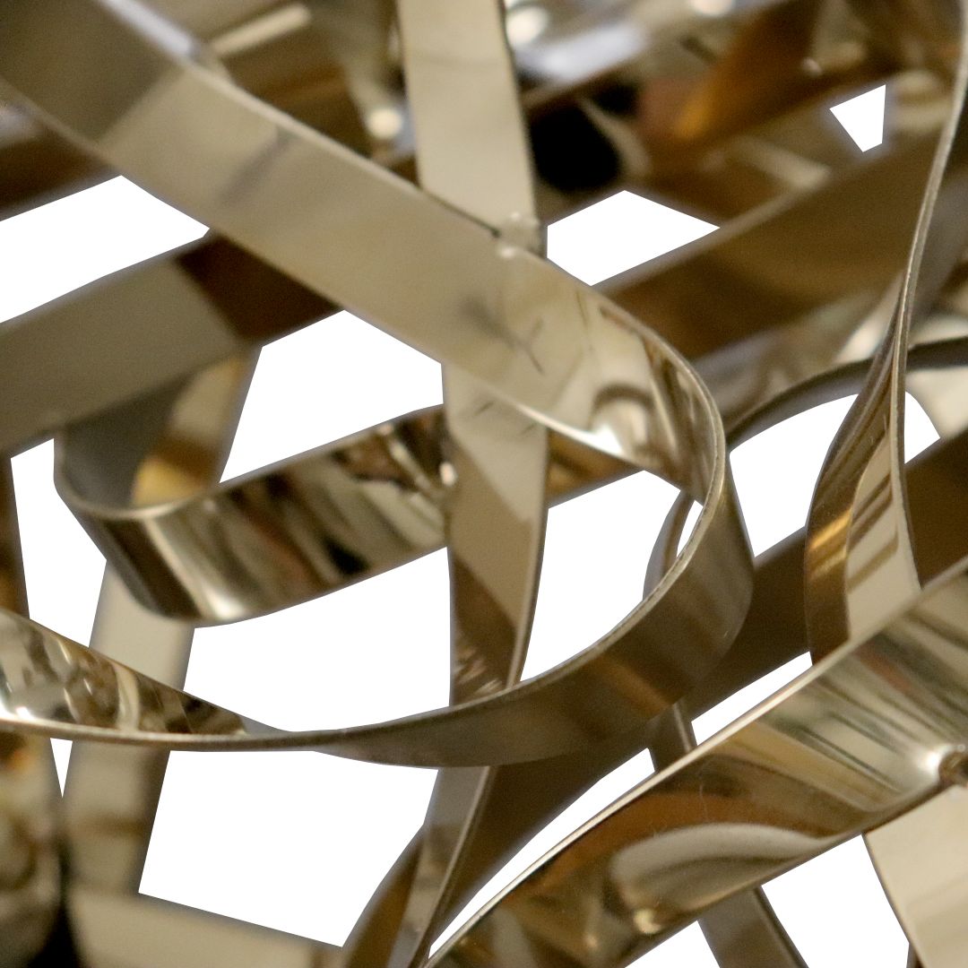 Handcrafted titanium and stainless steel artwork by BEACON, showcasing intricate metal sculpture with textured details.
