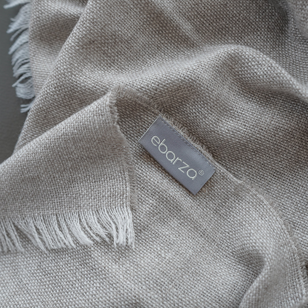 Soft HearthHug throw blanket by BEACON, 150GSM, cozy fleece fabric in neutral color, perfect for relaxing or adding warmth.