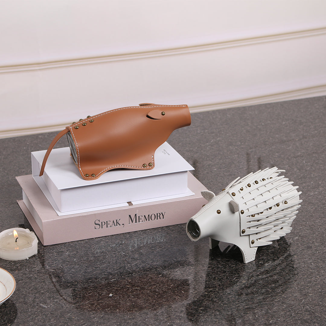 Beige ceramic hedgehog sculpture vase with detailed features, designed for decorative display and floral arrangements.