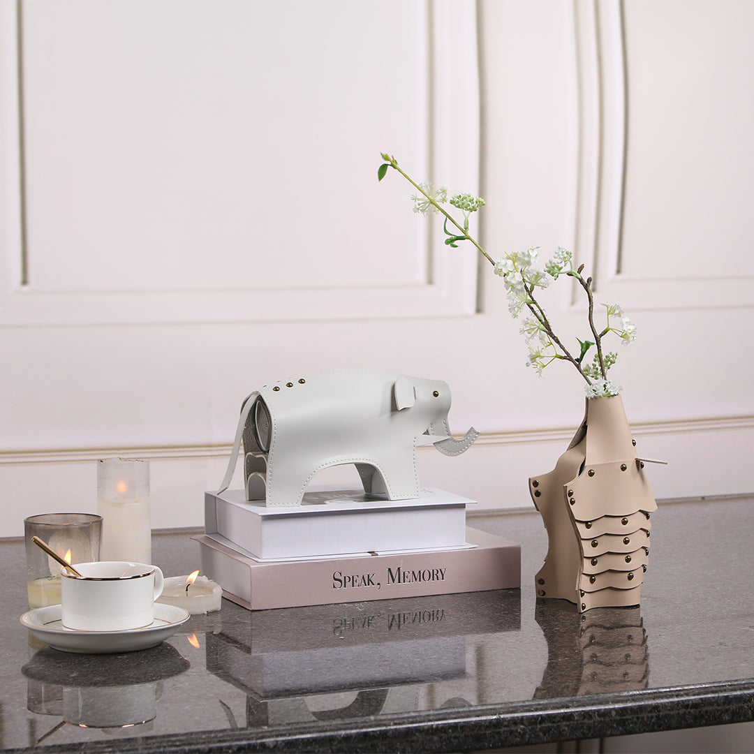 Beige ceramic hedgehog-shaped vase sculpture by BEACON, featuring detailed spines and a rounded body, perfect for home decor.