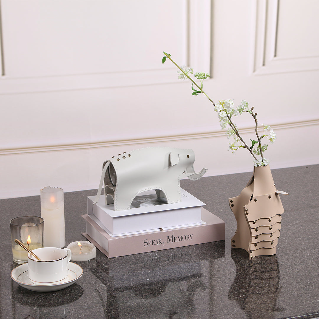 Beige hedgehog-shaped ceramic vase sculpture from BEACON, detailed with textured spines and a rounded body.