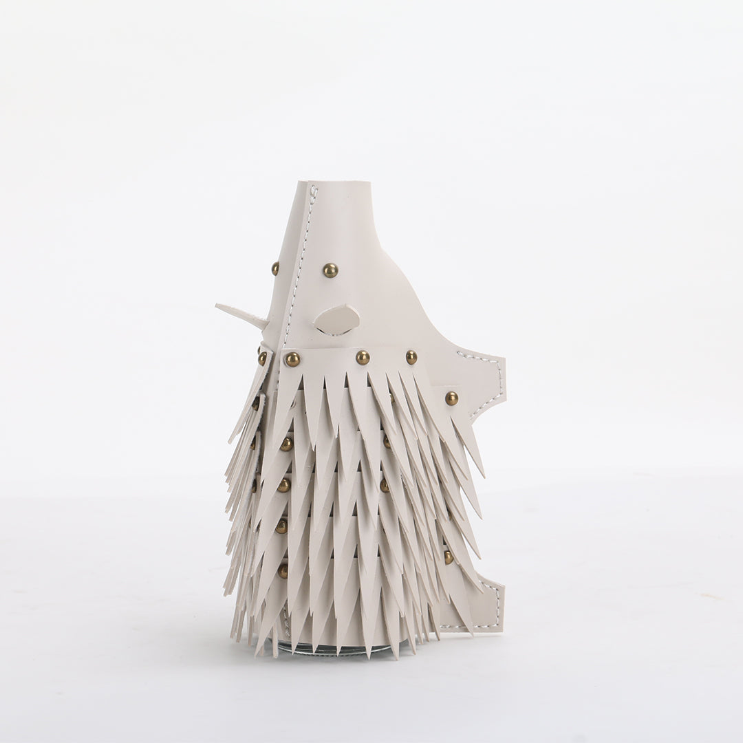 Beige hedgehog-shaped vase sculpture by BEACON, decorative ceramic vase with detailed hedgehog design.