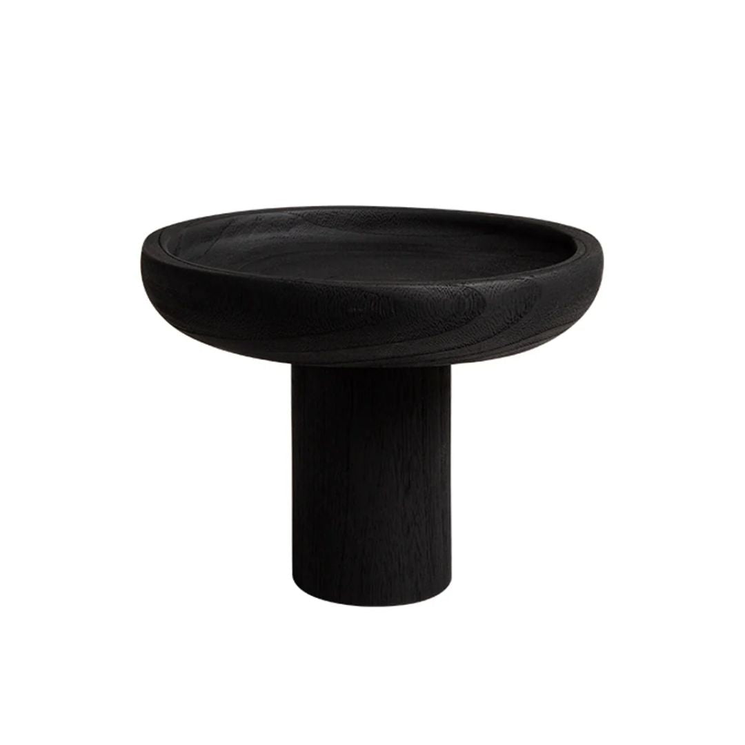 Black high-legged wooden fruit bowl from BEACON, designed for stylish fruit display and countertop decor.