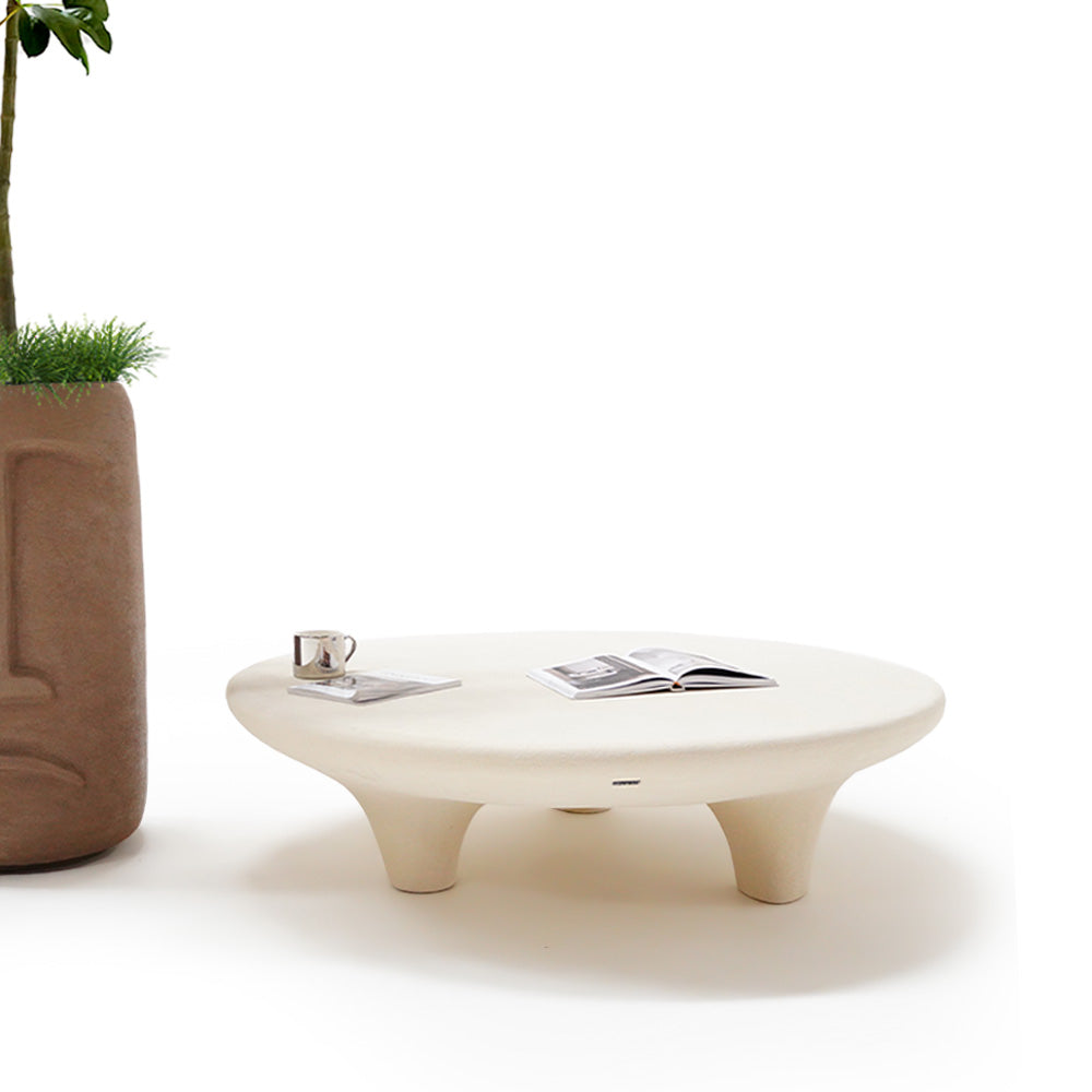 Indoor/outdoor beige coffee table from BEACON, with built-in planter boxes, stylish and versatile for indoor or outdoor use.