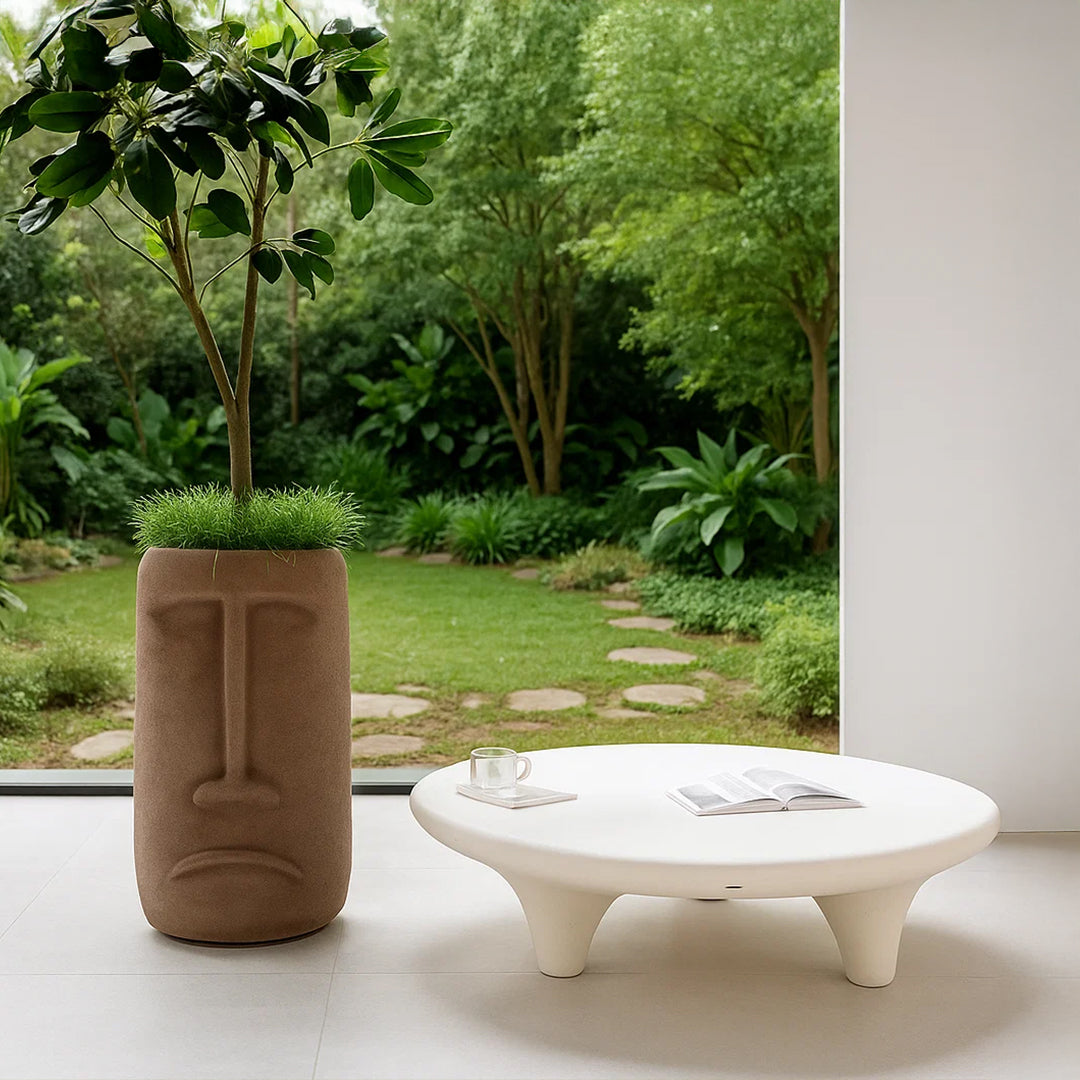 Beige indoor/outdoor coffee table with planter box design by BEACON, suitable for patio or living room decor.