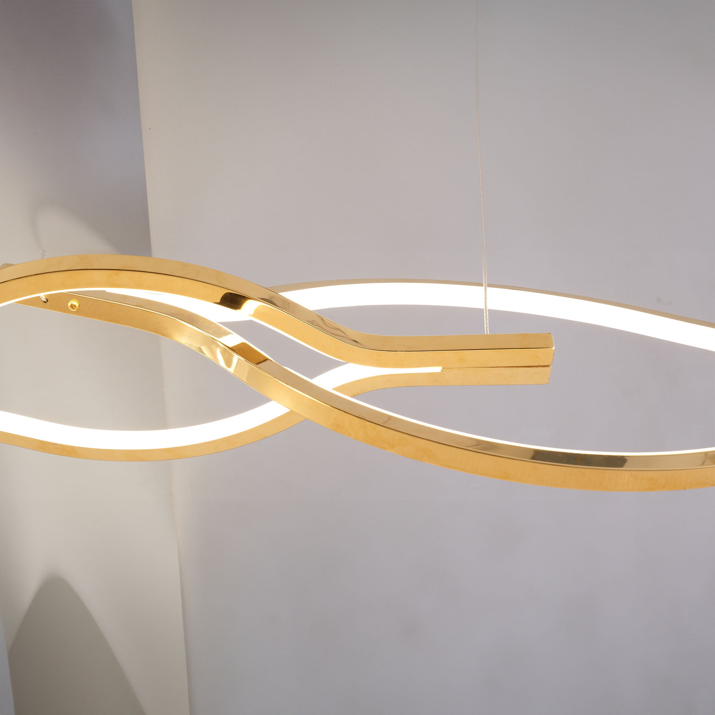 Infinity Orbit stainless steel pendant lamp by BEACON, modern spherical design with sleek metallic finish for contemporary lighting.