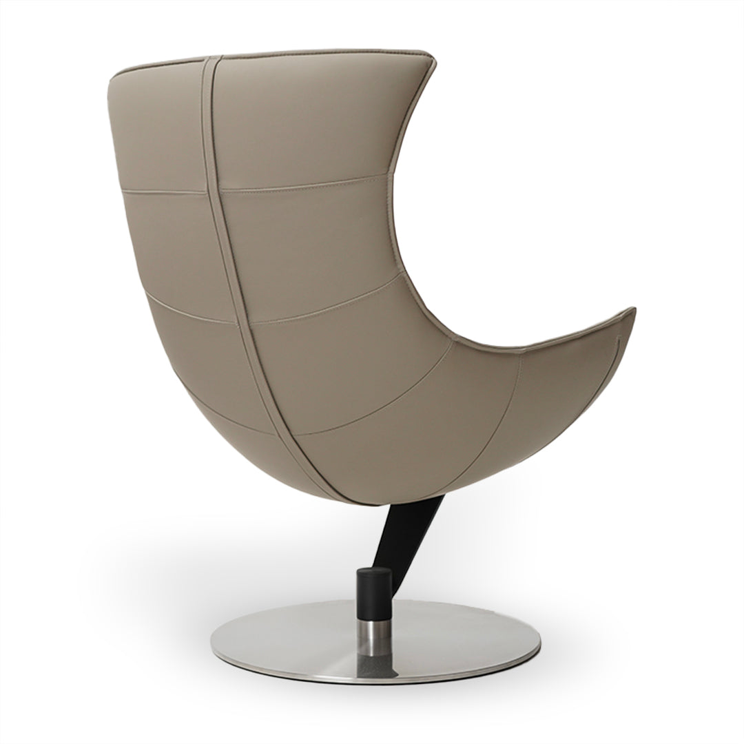 Beige JIATAI swivel lounge chair by BEACON, featuring a modern design with a rounded seat and swivel base.
