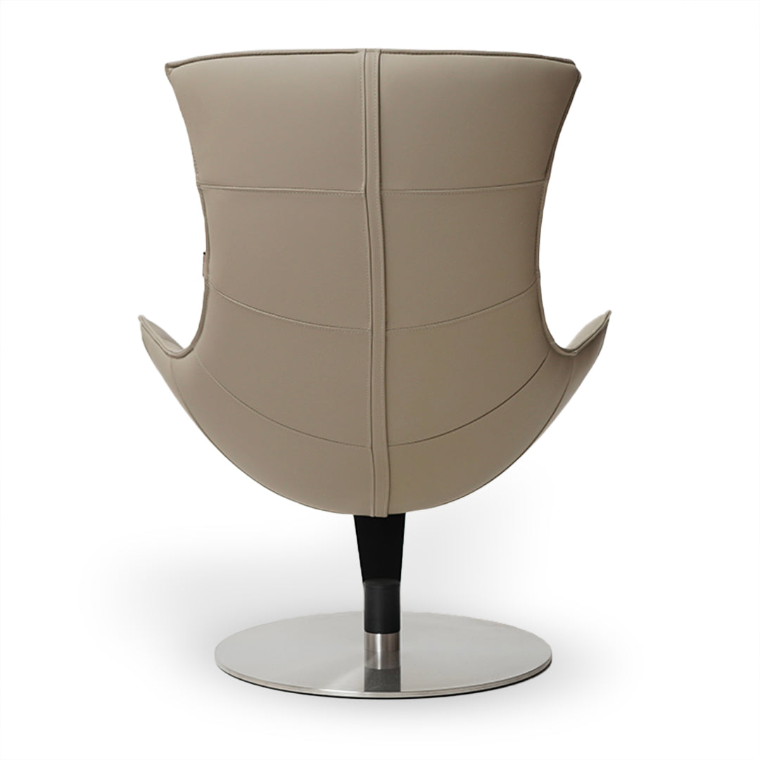 Beige JIATAI swivel lounge chair by BEACON, featuring a modern design with a cushioned seat and curved backrest.